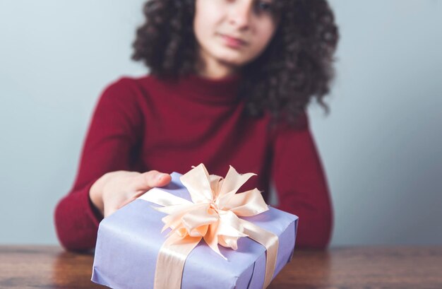 Woman hand holding gift box