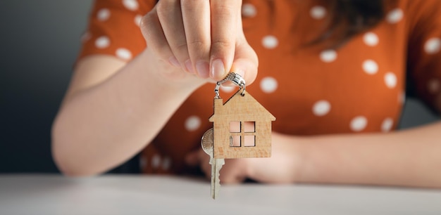 Woman hand holding house key