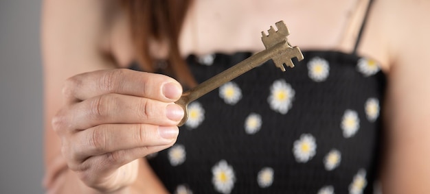 Woman hand holding key