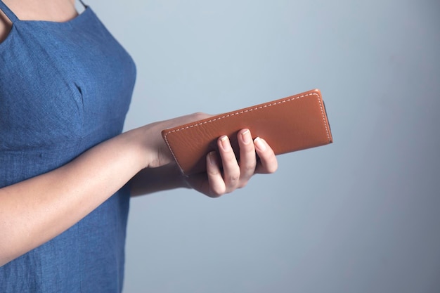 Woman hand holding notepad