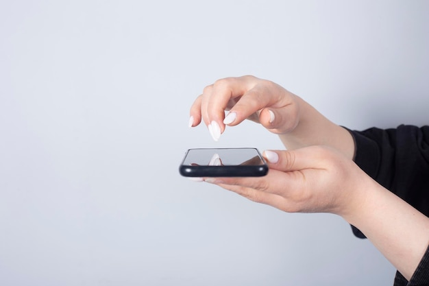 woman hand holding a phone