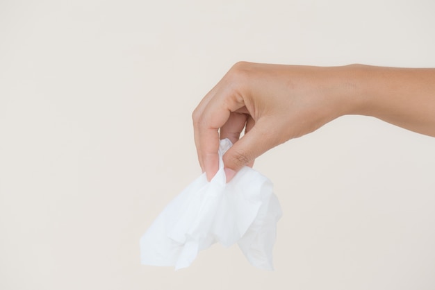 Woman hand holding or picking white tissue paper