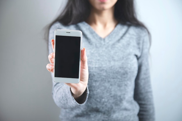 Woman hand holding smart phone