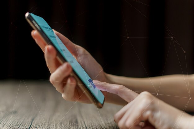 woman hand holding smartphone