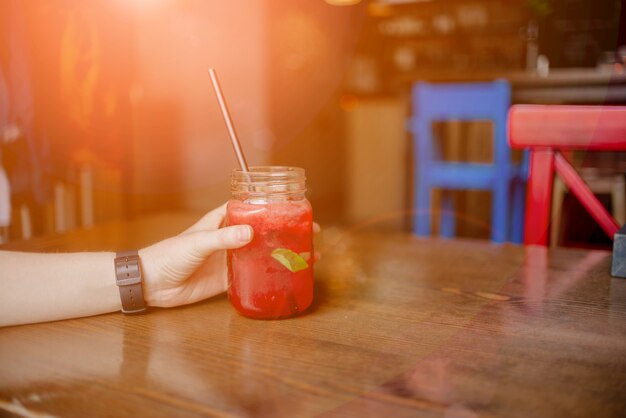 Woman hand holding smoothie shake 