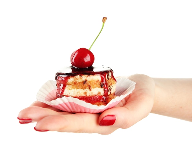 Woman hand holding tasty biscuit cake with jam and berry isolated on white