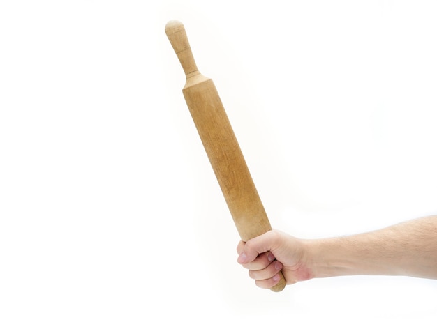 Photo woman hand holding a wooden rolling pin on a white background