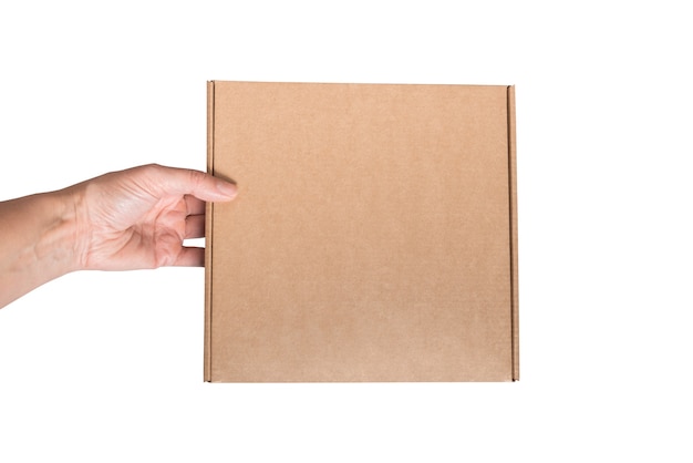 Woman hand holds brown cardboard box isolated