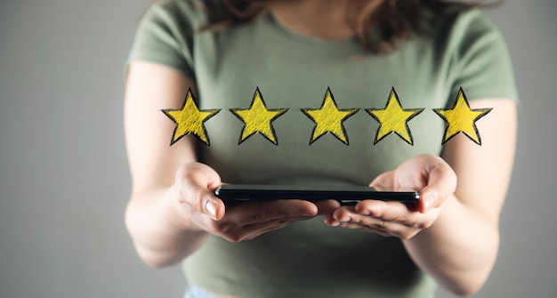 Woman hand holds tablet and stars