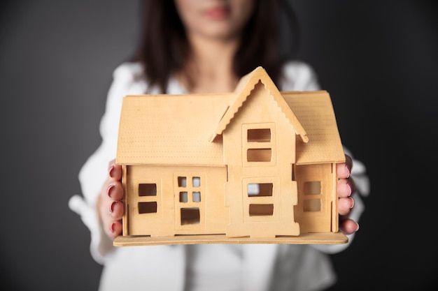 Woman hand house model