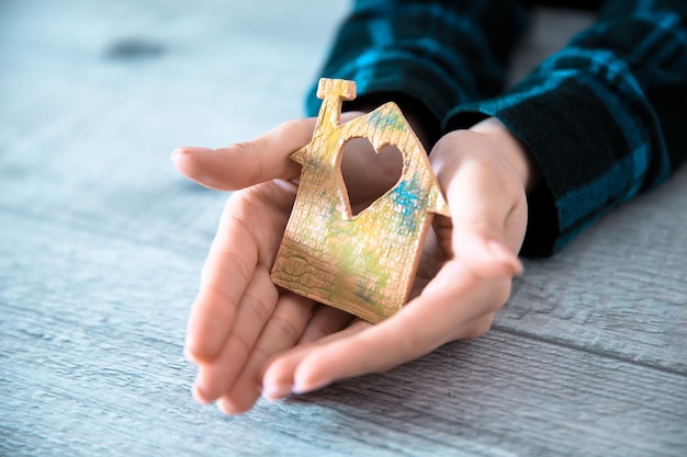 Woman hand house model