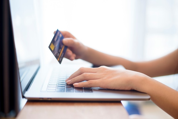 Woman hand is holding credit card