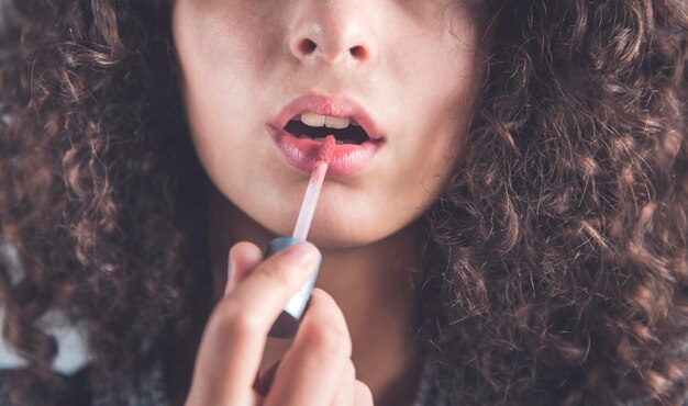 Woman hand lipstick