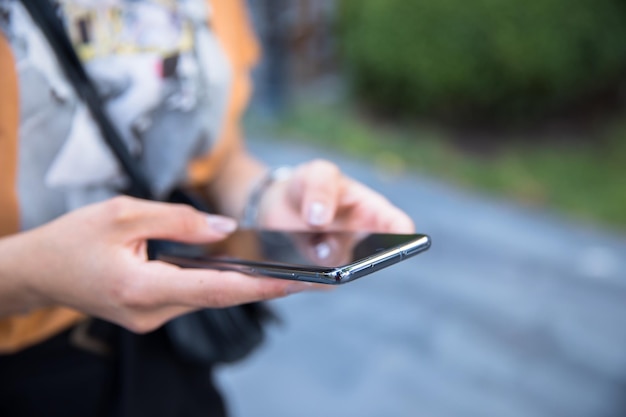 Woman hand phone in street