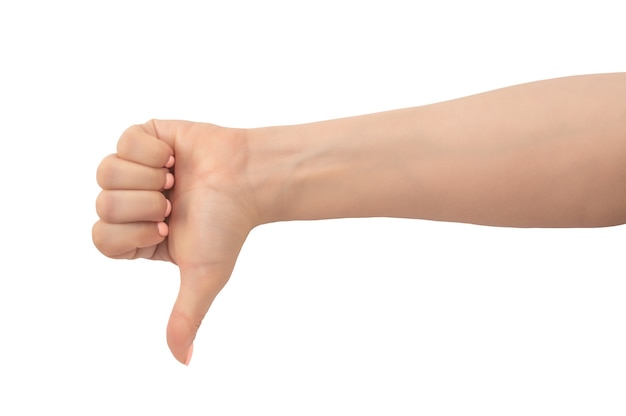 Photo woman hand thumb down sign isolated on white background. hand shows a thumbs-down gesture. close-up of female hand with a pink manicure gesture dislike, bad, disapproval isolated on white background