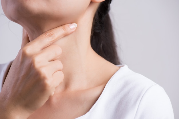 Woman Hand Touching Her Ill Neck