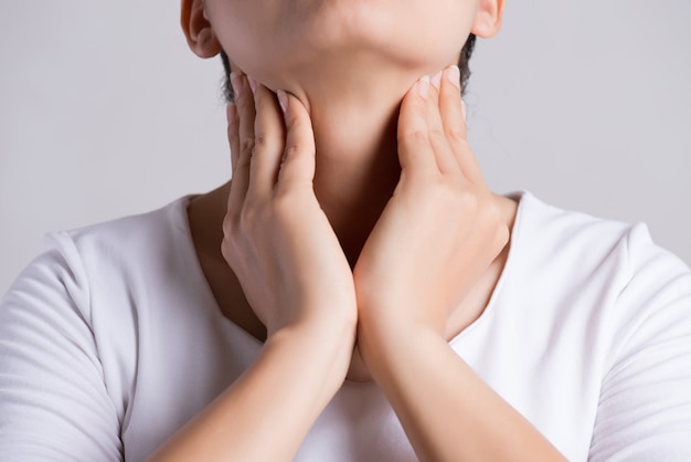 Woman Hand Touching Her Ill Neck. 