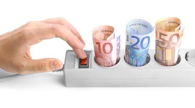 Photo woman hand turning off power socket with euro banknotes on white background