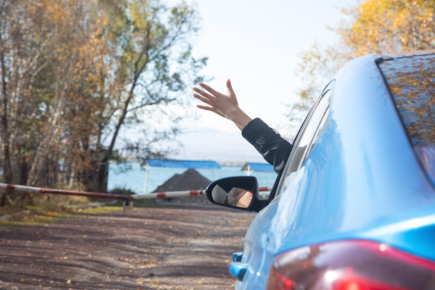 Woman hand up with a car Travel Lifestyle