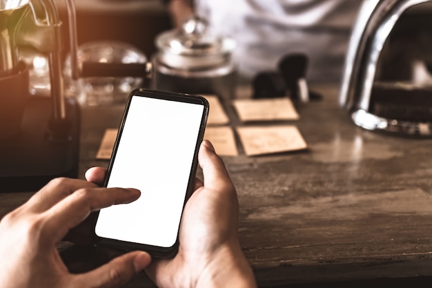 Woman hand use smartphone to do work business, social network, communication with white screen as copyspace.