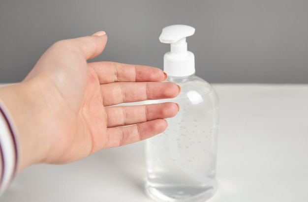 Woman hand using alcohol wash gel