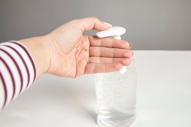 Woman hand using alcohol wash gel