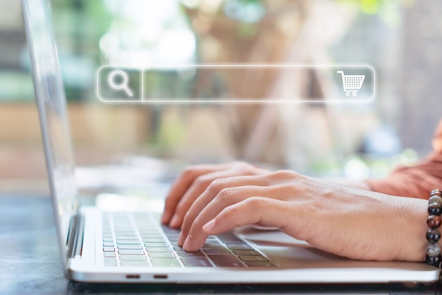 Woman hand using laptop or computor searching for information in online website.