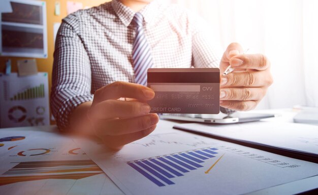 Woman hand using mobile smart phone online payment banking and online shopping at the home