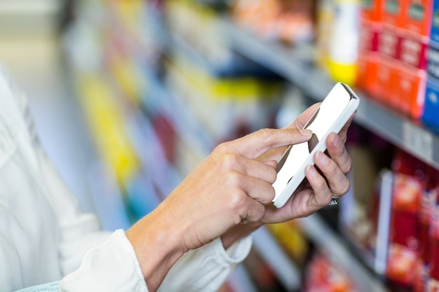 Woman hand using smartphone