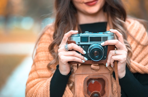 Woman hand vintage camera