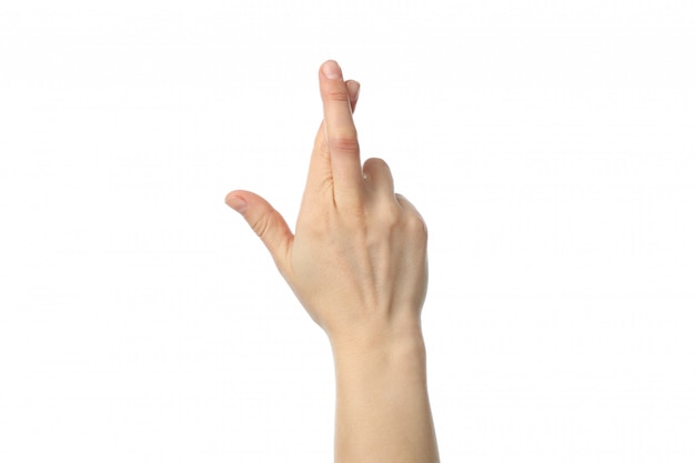 Woman hand with crossed fingers isolated on white background