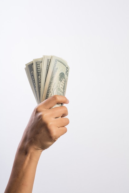 Photo woman hand with money isolated on white background