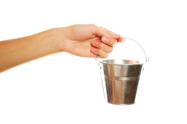 Woman hand with a steel pail