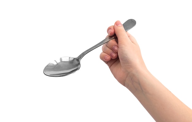 Woman hand with steel spoon, isolated on a white background photo