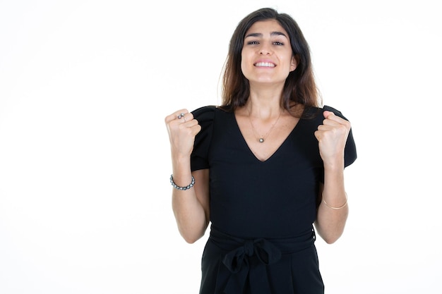 Woman hands closed clenched fist happy with joy with raised hands and clenching fists