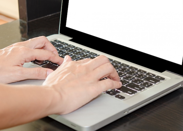 Woman hands on a computer keyboard.