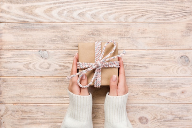 Woman hands give Present box