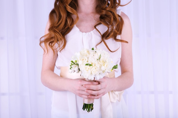 Woman hands holding beautiful wedding bouquet