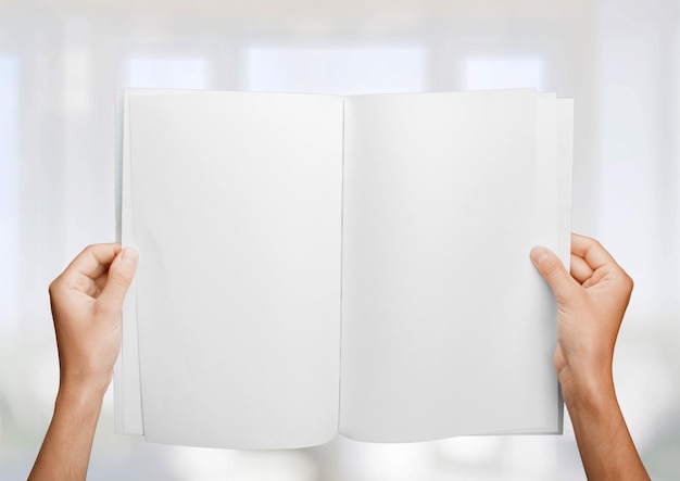 woman hands holding a blank book for