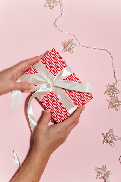 woman hands holding christmas gift box