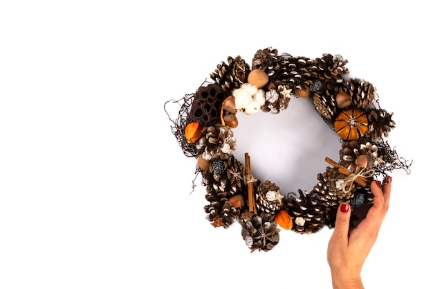 Woman Hands holding Christmas Wreath 