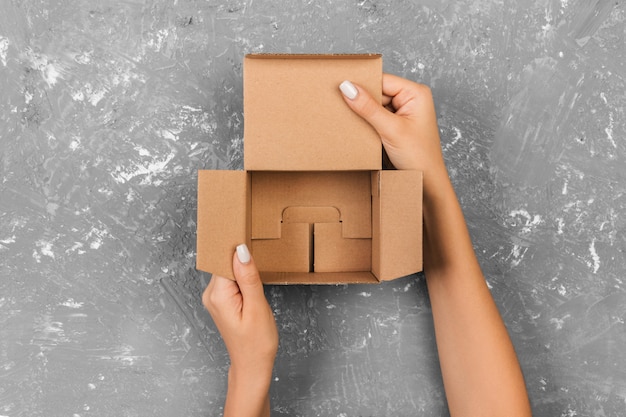 Woman hands holding empty box