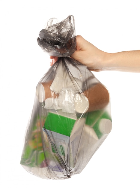 Woman hands holding garbage bag isolated on white 