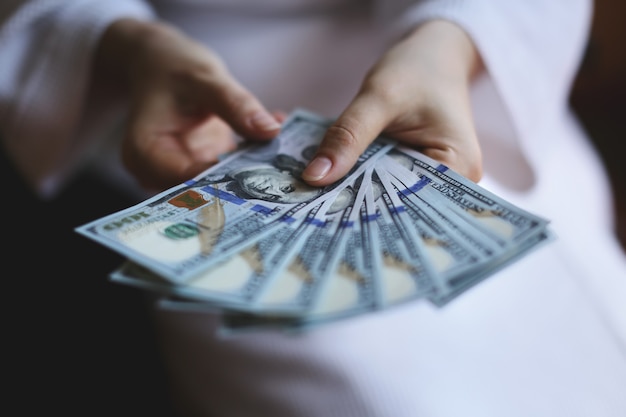 Woman hands holding money