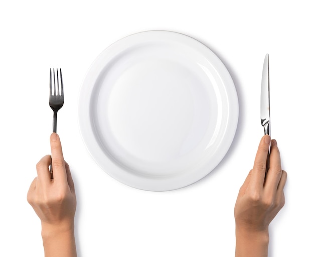 Photo woman hands holding a silver fork and knife