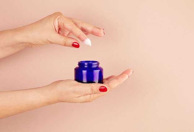 Woman hands holding skin care product