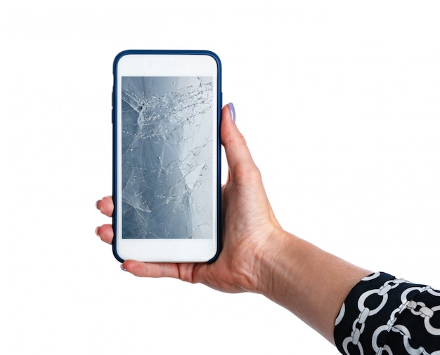 Woman hands holding smartphone with cracked screen isolated on white