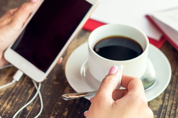 Woman hands holding smartphone.