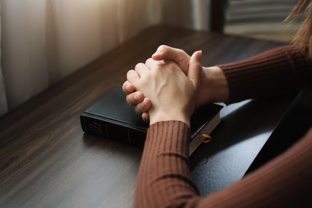 Woman hands praying to god with the bible Woman Pray for god blessing Religious beliefs Christian life crisis prayer to god