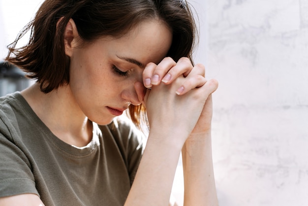 Woman hands praying to God.